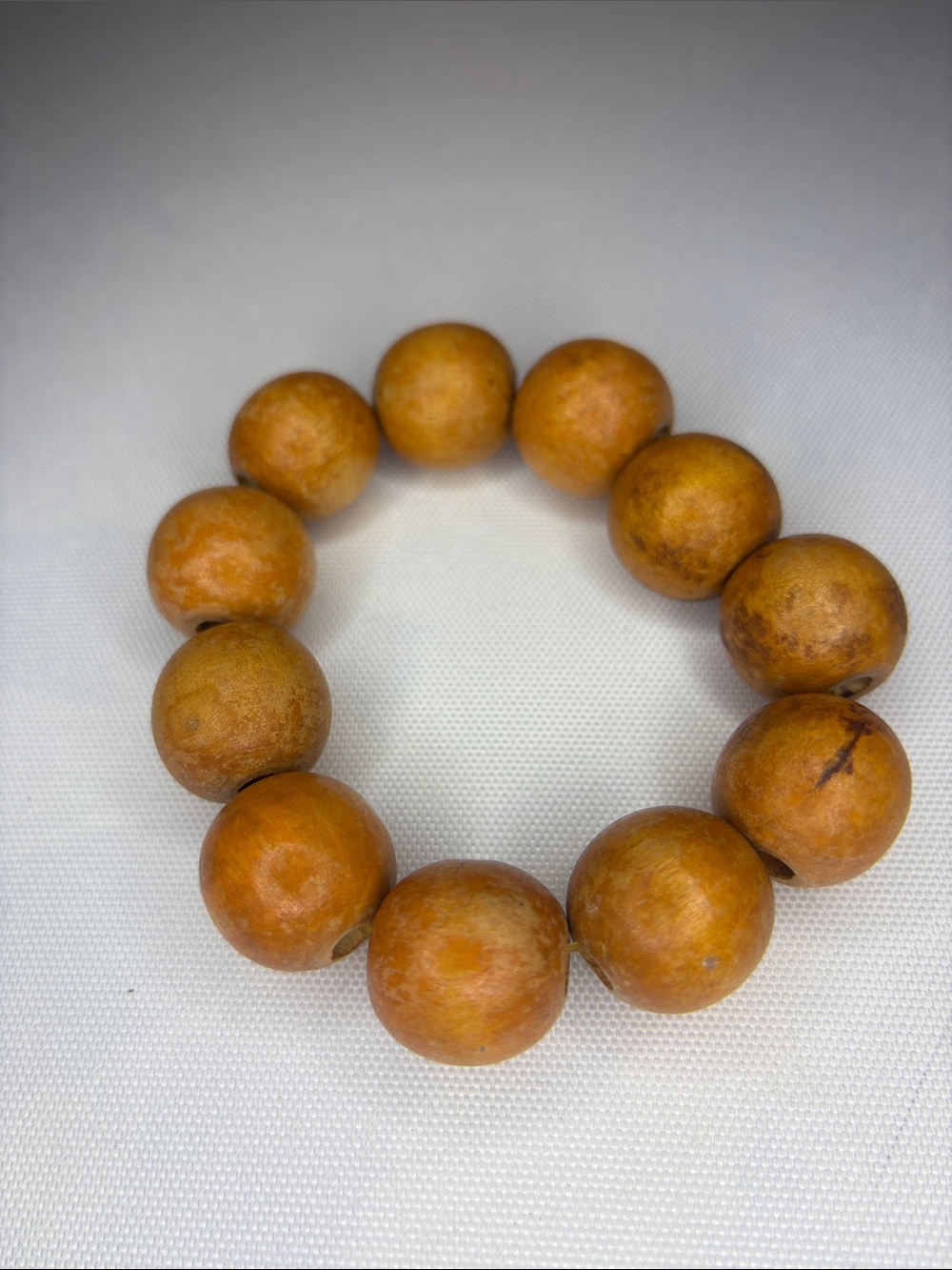 Orange, wooden or not chunky round beaded stretch bracelet